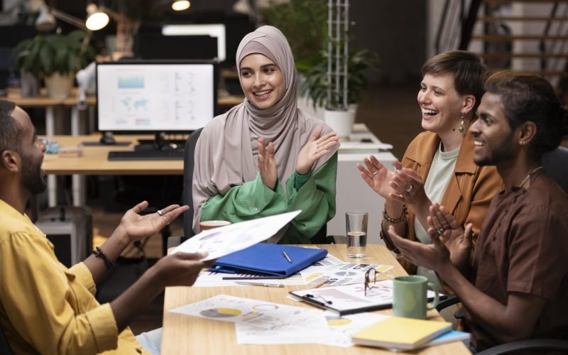 close-up-happy-colleagues-cheering